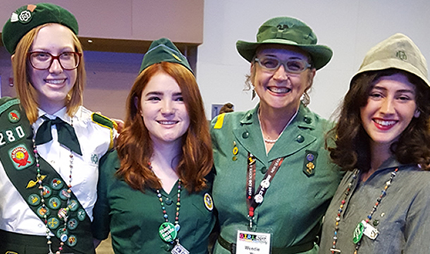 women in older girl scout uniforms