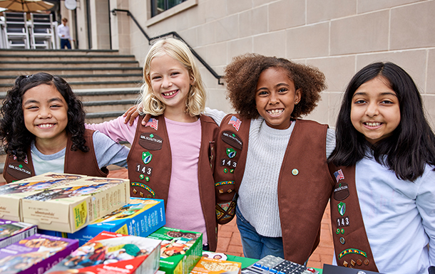 Image: A Girl Scout selling cookies.