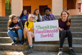 Girls holding banner